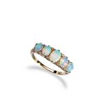 A FIVE STONE OPAL RING, CIRCA 1900 set with five oval opal cabochons graduating in size with diamond