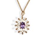 A VICTORIAN AMETHYST & GOLD PENDANT, CIRCA 1890 the central claw set amethyst within a wirework