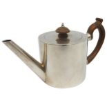 A GEORGE III SILVER TEA POT, simplistic drum form with angled spout, wooden scroll handle, bears the