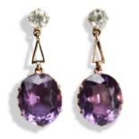 A PAIR OF AMETHYST AND ZIRCON DROP EARRINGS, CIRCA 1950 the oval cut claw set amethysts to a pierced