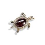 A VICTORIAN GARNET AND DIAMOND TURTLE BROOCH, CIRCA 1880 with the shell formed of a garnet