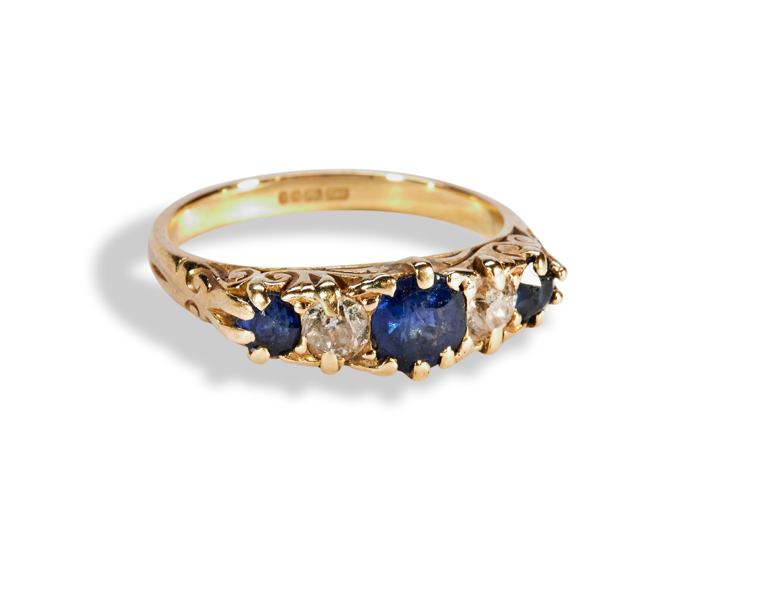 A DIAMOND AND SAPPHIRE FIVE STONE RING claw set with three mixed cut sapphires and two old cut - Image 2 of 3
