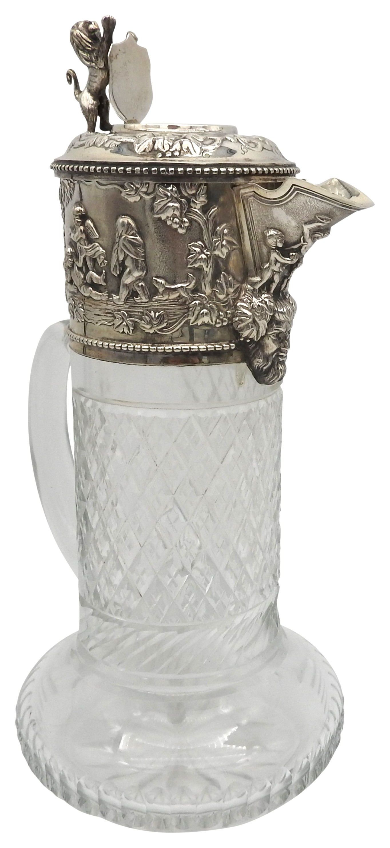 A SILVER MOUNTED CUT GLASS CLARET JUG, 20TH CENTURY, repousse decorated collar and lid depicting a - Image 2 of 3