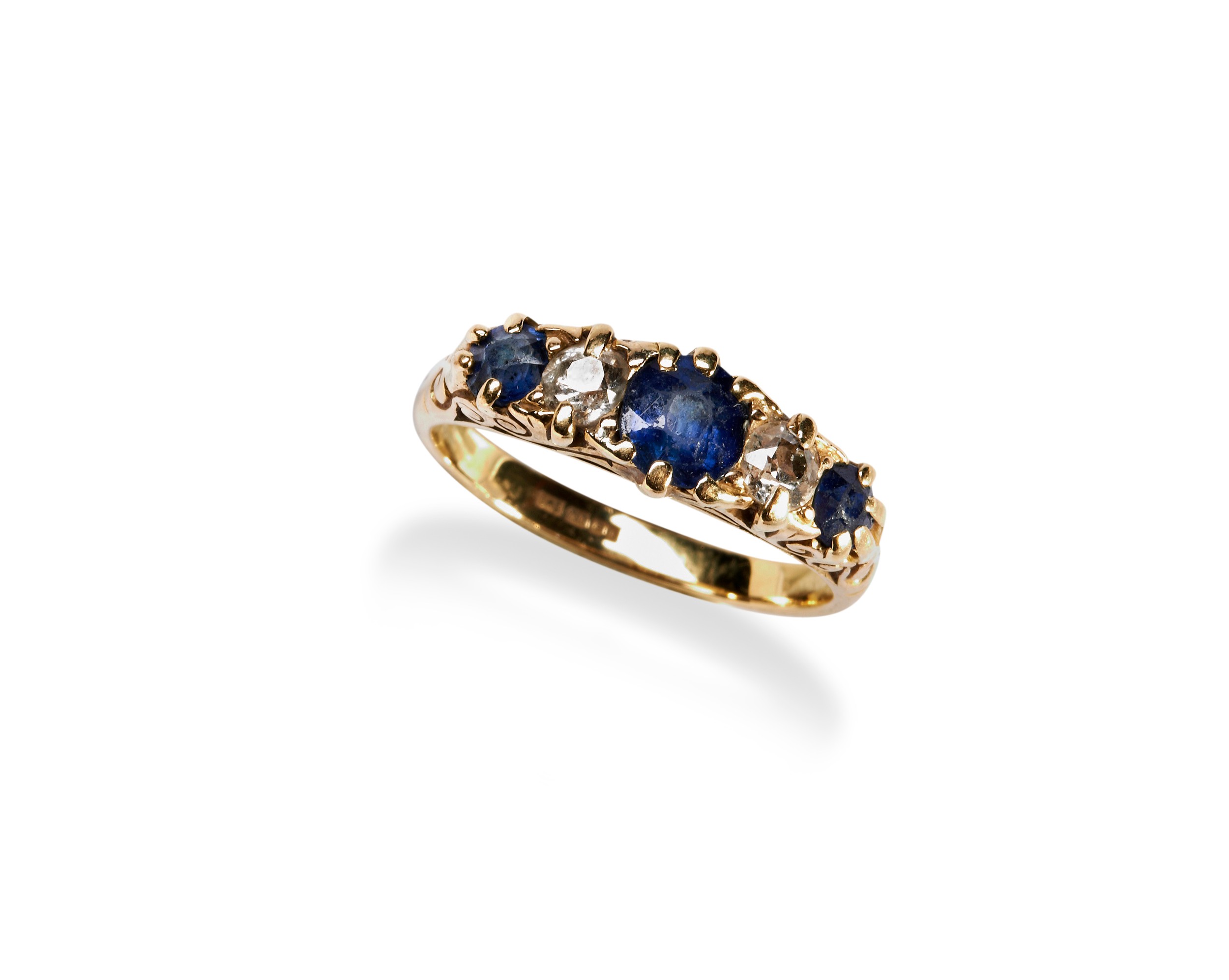 A DIAMOND AND SAPPHIRE FIVE STONE RING claw set with three mixed cut sapphires and two old cut