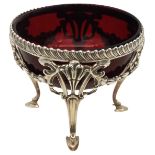 AN EDWARDIAN SILVER SUGAR BOWL WITH RUBY GLASS LINER, floral swag and scroll work body with
