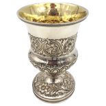 A GEORGE III SILVER GOBLET, campana form with gilded interior, repousse scroll foliate decoration to