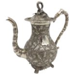 A CHINESE EXPORT SILVER COFFEE POT, late 19th Century, bears the mark of Cumwo, Hong Kong, the