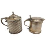 TWO SILVER MUSTARD POTS, both with blue glass liners, one with unusual beaded spiral decoration,