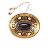 A VICTORIAN GARNET, GOLD AND ENAMEL BROOCH LOCKET, CIRCA 1860-70, the oval cabochon-cut garnet in