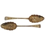 A PAIR OF GEORGE III SILVER BERRY SPOONS, JOHN LA, repousse and bright cut decoration, bears the