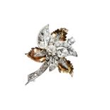 A DIAMOND LEAF BROOCH with three white metal diamond set leaves and three yellow and white metal