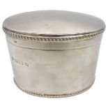A SILVER BISCUIT BARREL, ovoid form with gadrooned edge lid, bears the mark of Barker Ellis,