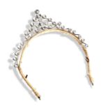 A SILVER PASTE TIARA  with claw set, round cut, clear paste on a ribbon wrapped head band.