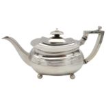 A GEORGE III SILVER TEAPOT, CIRCA 1810 boat shape form with fluted waist and elegant curved spout,