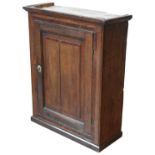 A LATE 18TH CENTURY OAK WALL CUPBOARD, with mahogany cross banding, the panelled cupboard door