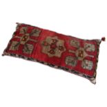 A PERSIAN HAND KNOTTED KHELIM CUSHION, blue border with fawn geometric patterns on a red ground