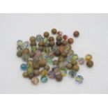 A BAG OF VINTAGE MARBLES, EARLY 20TH CENTURY, a mixture of glass colour twist and hardstone