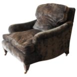 IN THE MANNER OF HOWARD AND SONS, UPHOLSTERED ARMCHAIR, CIRCA 1900 deep seat form raised on tapering