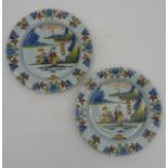 A PAIR OF DELFT POLYCHROME PLATES, 18TH CENTURY, under glaze and over glaze painted decoration