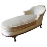 A 19TH CENTURY FRENCH UPHOLSTERED DAY BED, roll top headboard with downswept padded sides, on a
