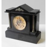 A VICTORIAN SLATE MANTEL CLOCK, CIRCA 1860 with visible escapement and striking gong, the chapter