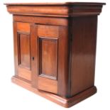 A VICTORIAN MAHOGANY TABLE TOP TRINKET CABINET, CIRCA 1850, cushion moulded top and plinth, with two