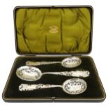 A LATE VICTORIAN BOXED SET OF THREE SERVING SPOONS , CIRCA 1899, consisting of a large spoon and a