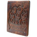 A DUTCH FRUIT WOOD GINGERBREAD MOULD, LATE 18TH CENTURY, one side carved with an image of a galleon,