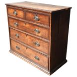 A 19TH CENTURY OAK CHEST OF DRAWERS, with mahogany crossbanding, comprised of two short drawers over