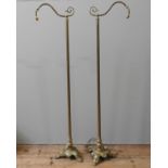 A PAIR OF EDWARDIAN FLOOR STANDING BRASS READING LAMPS, EARLY 20TH CENTURY, each lamp with an