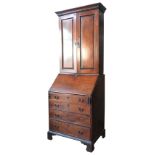 AN 18TH CENTURY MAHOGANY BUREAU BOOKCASE, in two sections, moulded dentil cornice above two panelled