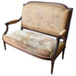 A LOUIS XVI-STYLE SALON SETTEE, 19TH CENTURY, tapestry covered back panel and over stuffed seat