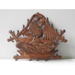 A CARVED BLACK FOREST WALL MOUNTED RACK, EARLY 20TH CENTURY