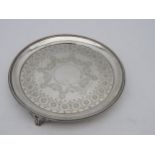 A VICTORIAN SILVER SALVER, CIRCA 1870 with beaded edge, circular cartouche surrounded by engraved