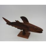 A VINTAGE CARVED SOUVENIR FLYING FISH, CIRCA 1950, carved from Miro wood by inhabitants of