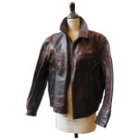 A BATTERED TAN LEATHER JACKET (Size 46) made to order by Aero Leathers Clothing Co, Scotland (Blue