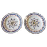 A PAIR OF DELFT POLYCHROME PLATES, 18TH CENTURY,  both with underglaze and over glaze decoration,