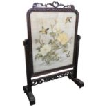 A CHINESE STYLE FIRE SCREEN, EARLY 20TH CENTURY, scroll foliate cresting above an arched