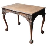 A MAHOGANY SILVER TABLE, 19TH CENTURY gadrooned edge top above a a scroll foliate carved frieze,