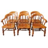 A SET OF SIX 19TH CENTURY GOLDEN OAK SMOKERS BOW CHAIRS, curved scrolling top rail supported by