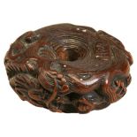 A FINE JAPANESE CARVED WOOD NETSUKE BY MASATOMI EDO PERIOD, 18TH CENTURY modelled as a coiled