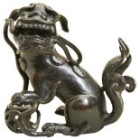 A SMALL BRONZE BUDDHIST LION LATE MING DYNASTY possibly a finial from a larger item 9cm high
