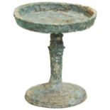 A BRONZE CANDLEHOLDER Han Dynasty (202BC - AD220) the dished circular top supported by a socle