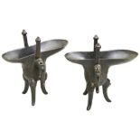 A PAIR OF BRONZE ARCHAISTIC RITUAL TRIPOD WINE VESSELS, JUE FOUR CHARACTER MARK ????, QING