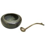 A SMALL BRONZE WATERPOT AND A SPOON QING DYNASTY (AD1644 - 1911) of compressed globular form, the