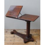 A EARLY VICTORIAN ROSEWOOD BED TABLE, the fluted edge rounded rectangular top in two sections, one