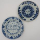 TWO EARLY 19TH CENTURY DELFT BLUE & WHITE PLATES, one with a central inscription with scrolling
