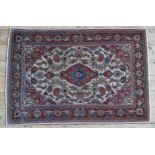 A HAND KNOTTED KASHAN RUG, 20TH CENTURY, central medallion surrounded with a profusion of