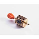 A GOOD GOLD MINIATURE SPINNING TOP CHARM, with enamelled playing card faces, topped with coral