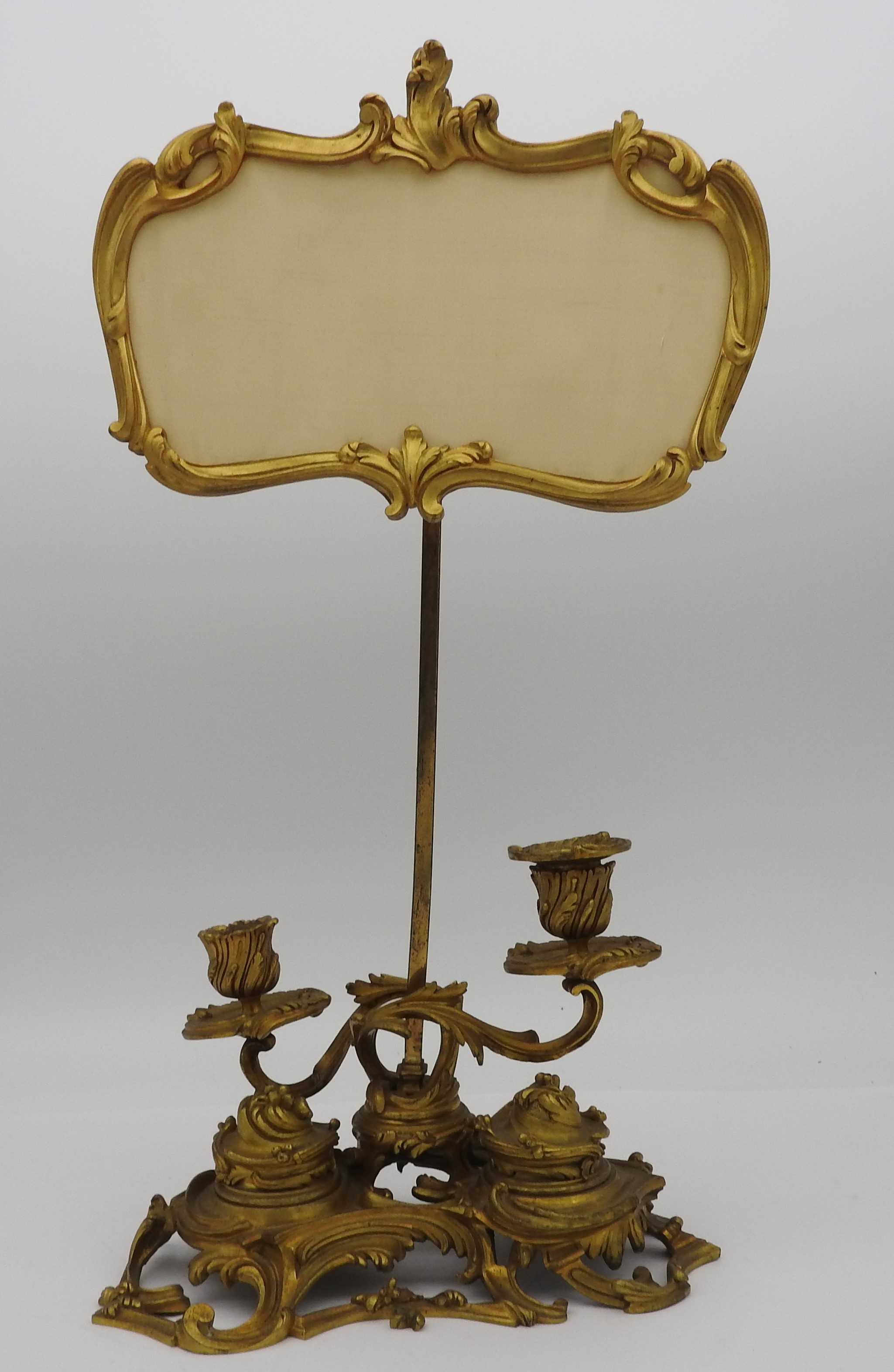 AN UNUSUAL FRENCH GILT METAL ROCOCO INK STAND, EARLY 19TH CENTURY, adjustable cartouche shaped